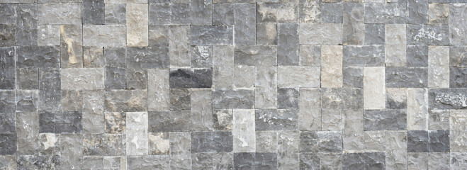 Nature Stone wall texture for background and wallpaper. Abstract rough wall pattern panoramic dimensions.