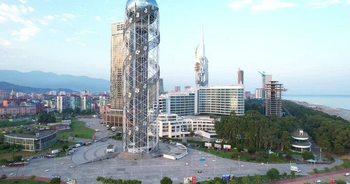 Beautiful view from the height of the city of Batumi, Georgia. The city at dawn by the sea. The coast of Batumi. Alphabet Tower.