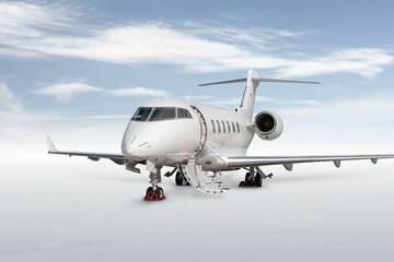 Close-up modern white private jet with an opened gangway door isolated on bright background with sky