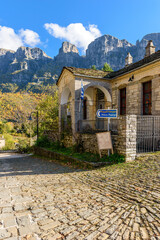 view of traditional architecture with stone buildings and background astraka mountain during fall season in the picturesque village of papigo , zagori Greece	
