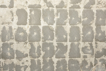 Concrete wall with tile adhesive residue