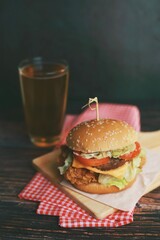 Delicious homemade beef burger on wooden table.
