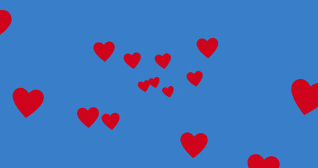 Image of red hearts spread on blue background