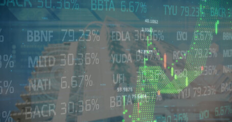 Financial and stock market data processing against tall buildings in background