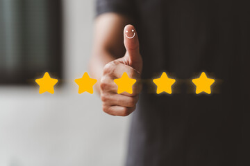 Business people are giving thumbs up to show their satisfaction, customer satisfaction, in 5 star service, warranty, standard, product and service quality, iso certification, standardization concept.