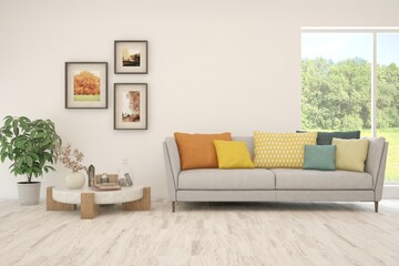 Fototapeta premium White living room with sofa and summer landscape in window. Scandinavian interior design. 3D illustration