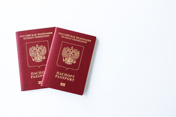 Russian international passports on a white background. The concept of a vacation for two abroad.