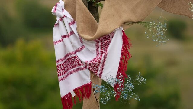 4k video with a traditional Romanian scarf or vintage kitchen towel with red and white models part of the Romania culture and traditions. Concept film for Romania, mixing nature and clothing. 
