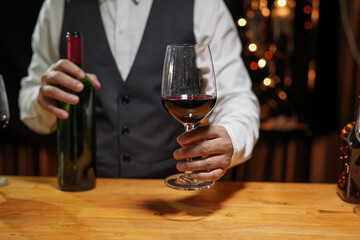 Bartender Serve wine, on wood bar, 