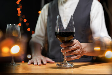 Bartender Serve wine, on wood bar, 