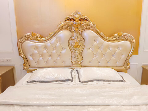 Luxurious Bed In Soft Tones With Gold Furniture Details. A Large, Comfortable Royal King Bed In A Classic Cabin.