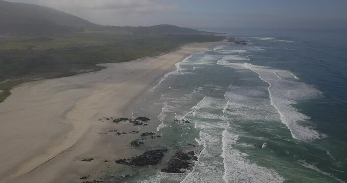 Aerial view of Afife beach (arda or mariana) at Atlantic Ocean in Portugal in sunny day with perfect waves and yellow sand.