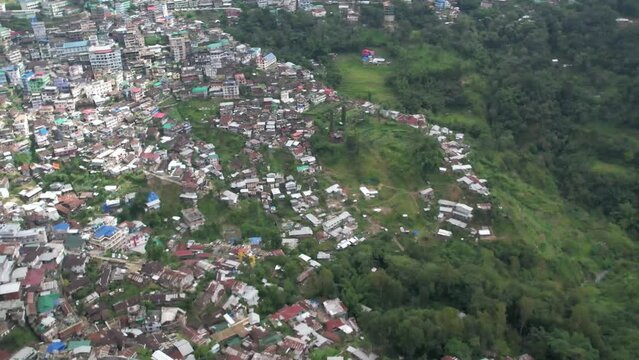 Expansion of a village leads to deforestation in a aerial view.