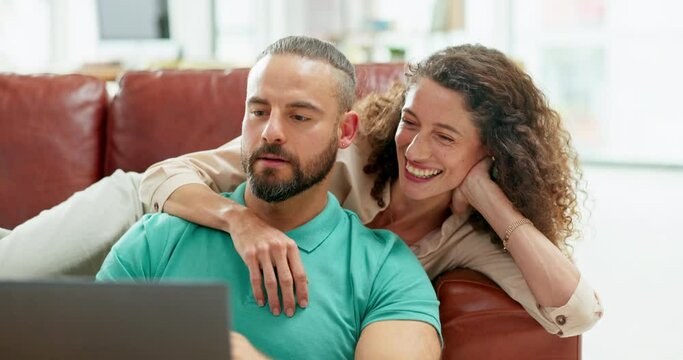 Couple, laptop and laughing at online comic video, meme or joke while talking, bonding and relaxing on sofa in lounge at home. Happy man and woman surfing web or internet for entertainment in Russia