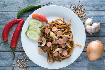 Mie Gomak, Traditional Food from North Sumatera, Indonesia. This noodle is modified with the addition of sausages, small pieces of chicken, and cooked by frying