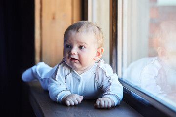Fototapeta premium A small newborn baby boy. The concept of childhood