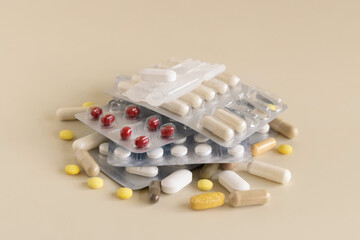 Mix of pills and capsules in a used plastic blisters close up. Taking dietary supplements