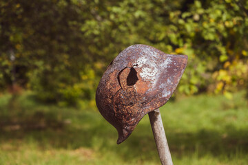 Steel German helmet with a hole