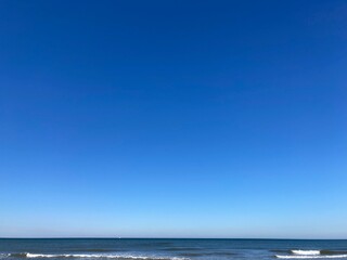 Naklejka na ściany i meble the calm sea with blue sky 
