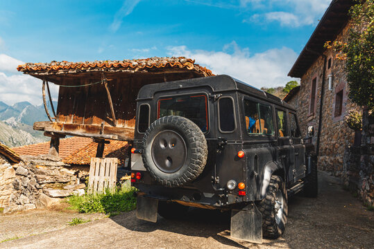 black off-road car model Land rover defender touring the national park of picos de europa, spain.