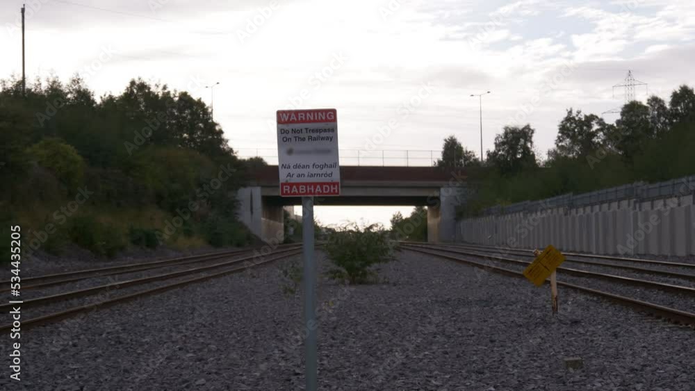 Poster timelapse of irish rail trains traveling through the railroads with do not trespass on the railway w