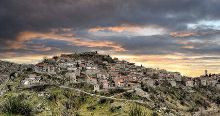 Fototapeta premium Panoramic view of a beautiful mountain village named Dimitsana at sunset. Peloponesse, Greece.