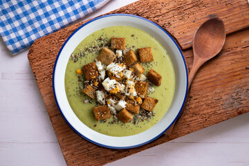 Artichoke cream with bread croutons and boiled egg. Typical Spanish vegan tapas.