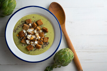 Artichoke cream with bread croutons and boiled egg. Typical Spanish vegan tapas.