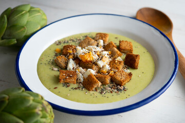 Artichoke cream with bread croutons and boiled egg. Typical Spanish vegan tapas.