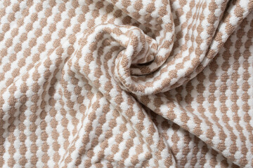 Fototapeta na wymiar Warm knitted sweater with a pattern. Woolen sweater, knitted sweater texture, knitted background. Knitted textured background with a pattern closeup 