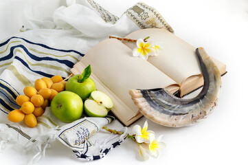 Tallit, shofar (horn), apple,  pomegranate, dates and Torah. Rosh Hashanah (jewish holiday) concept