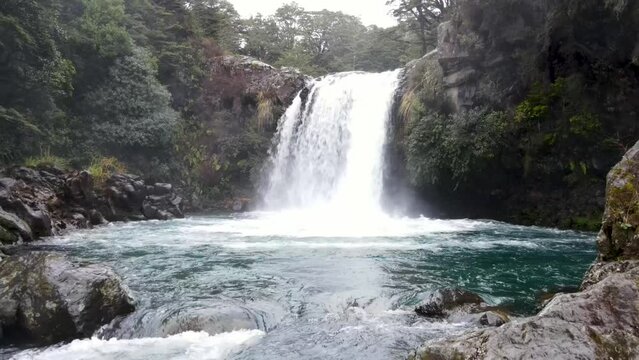 Aerial pull back from famous tourist attraction of Gollum's Pool from Lord of the Rings movie set, New Zealand