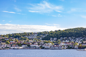 Fototapeta premium Buildings in Drøbakk town seen from the sea side,Oslo fjorden,Norway,Europe