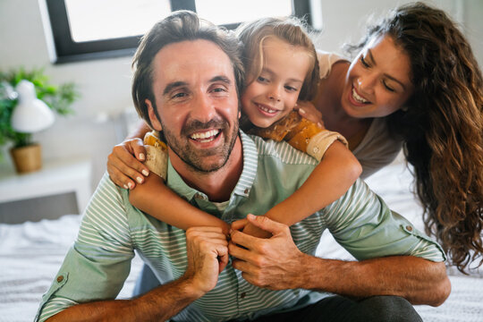 Happy family having fun time at home. People love child home concept.