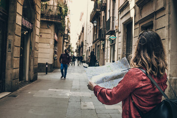 tourist woman with a map in Barcelona city street