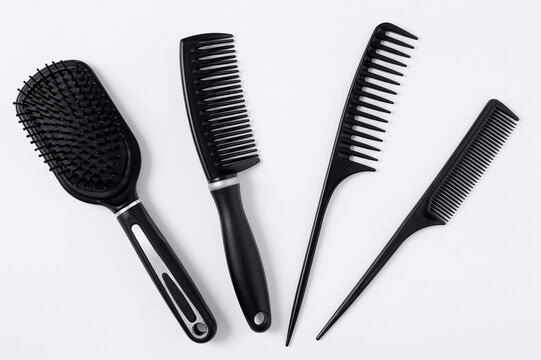 Set  four black hair combs. White background.