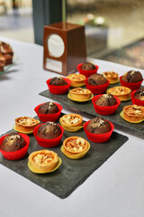 Sweet, buffet table with cakes, pies, cookies with glaze.