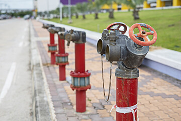 Fototapeta na wymiar Red water nozzle for further use in firefighting applications.