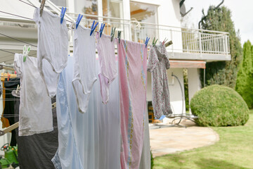 Washed wet things after washing dry on a dryer in the yard.