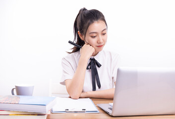 Asian female students taking an online class against a white background