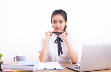 Asian female students taking an online class against a white background