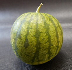 Traditional Ankara, Kazan, Plain Black Watermelon on textured black background, 