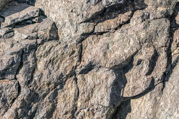 texture of old stone rock surface.Brown stone or rock background and texture.horizontal black stone texture for pattern and background