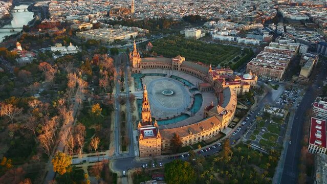 Morning view of Seville city and Plaza de Espana with Maria Luisa Park. Aerial view of Plaza de Espana - Spanish Square - at sunrise in Seville, Spain