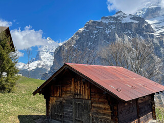 Stunning views of Murren - Gimmelwald surrounded by snowy peaks. with cottage-style villages and huts along the hiking trails. Switzerland