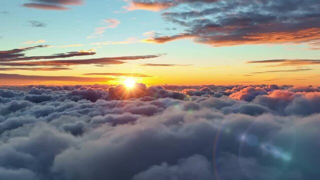 Morning sun comes out from behind the clouds. Epic sunrise over the clouds. Aerial shot of great sunrise clouds