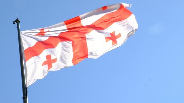 Large flag of Georgia waving in the wind