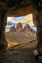 View to Tre Cime di Lavaredo in sunrise time from a cave, which was used during the First World War, Dolomites