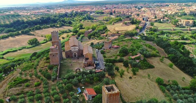 Aerial view of the church of San Pietro in Tuscania. Place of Catholic worship in Tuscania which stands on the hill of the same name, site of the Etruscan acropolis. Circular movement around the Basil