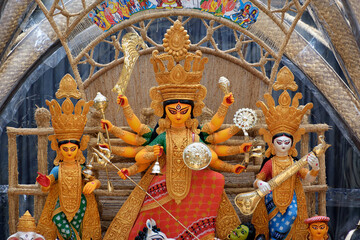 Idol of Goddess Devi Durga at a decorated puja pandal in Kolkata, West Bengal, India. Durga Puja is...